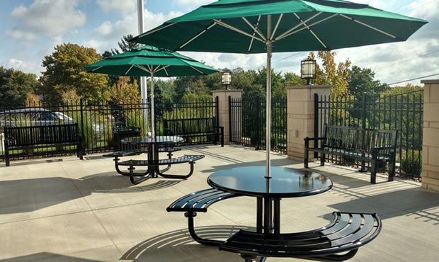 Penn Table Sets with umbrellas on a corporate patio
