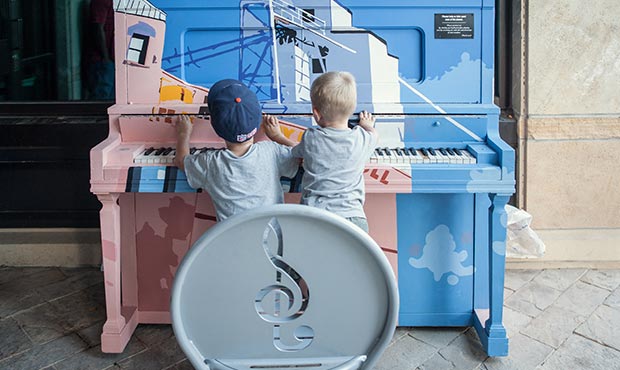 A couple of future piano players exploring the world of music