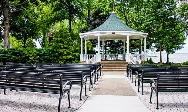 Rows of Schenley Benches face the pavilion stage