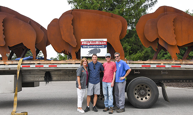 Family In Front of Metal Bisons