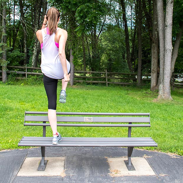 Step Up With Knee Drive Exercise on a Penn Bench