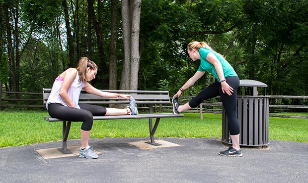 Stretching before exercising on a Penn Bench
