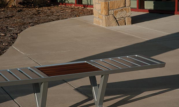 Volant Flat Bench situated outside a corporate campus