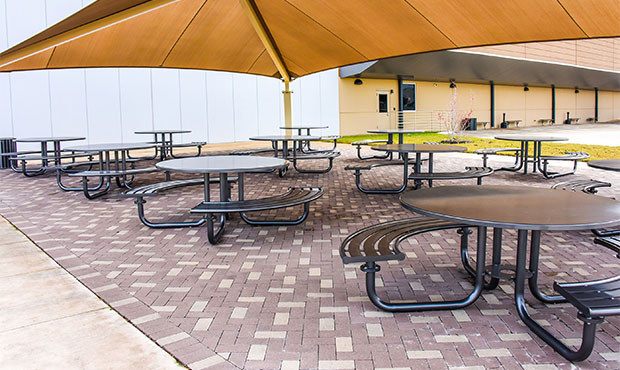 Penn Table Sets situated under a canopy outside