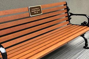 Wood Grain Aluminum Slats on Rosedale Bench with Back and cast bronze plaque
