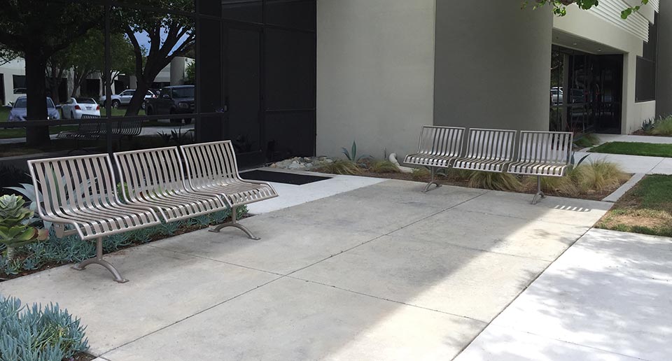 Pullenium Benches with Back flank the entrance to an office building
