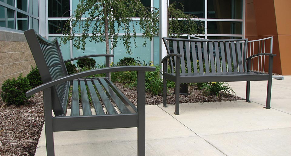 Exeter Site Furniture products sit by the entrance to a YMCA