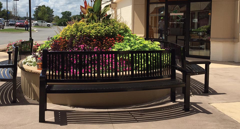 Custom Curved Reading Bench with Back at an outdoor shopping mall