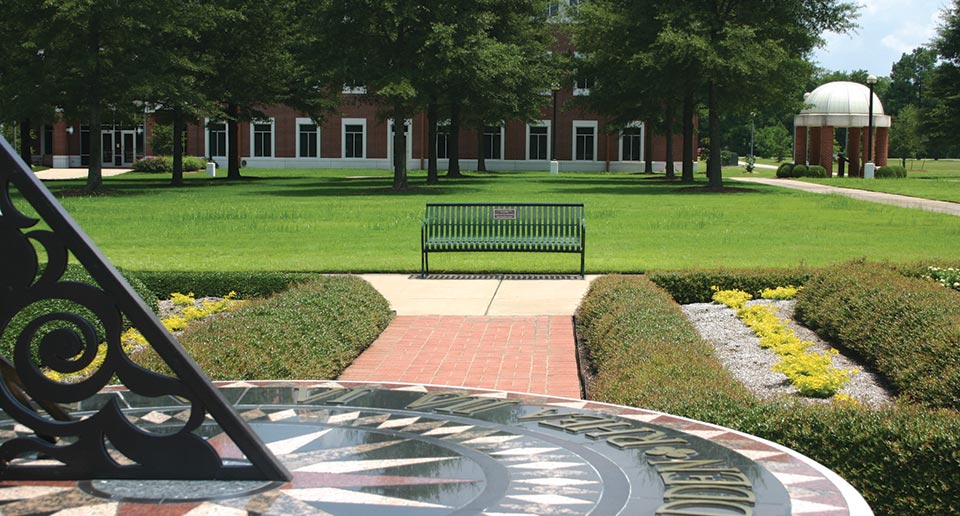 Pullman Bench with Back and Plaque in a college campus setting